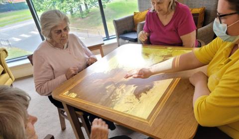 Residents playing with the interactive light games 