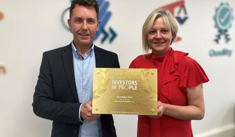 Neil Quinn and Sarah Clarke-Kuehn with Sanctuary Care's Investors in People Award 