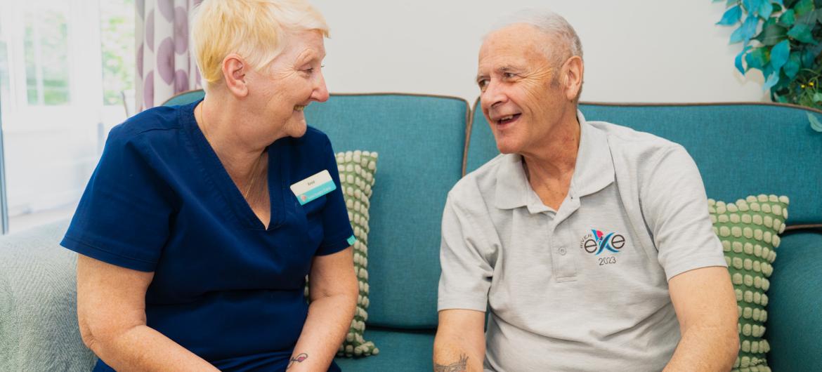 Resident and Carer in living room