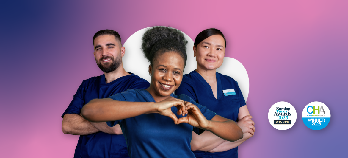 ID20 Jobs nursing careers - Full width banner Three people in blue nursing uniforms standing together in front of a heart-shaped background.