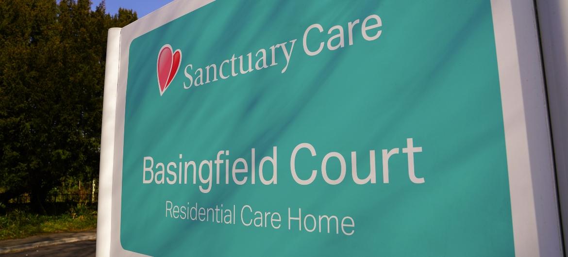 A sign reading Sanctuary Care Basingfield Court Residential Care Home