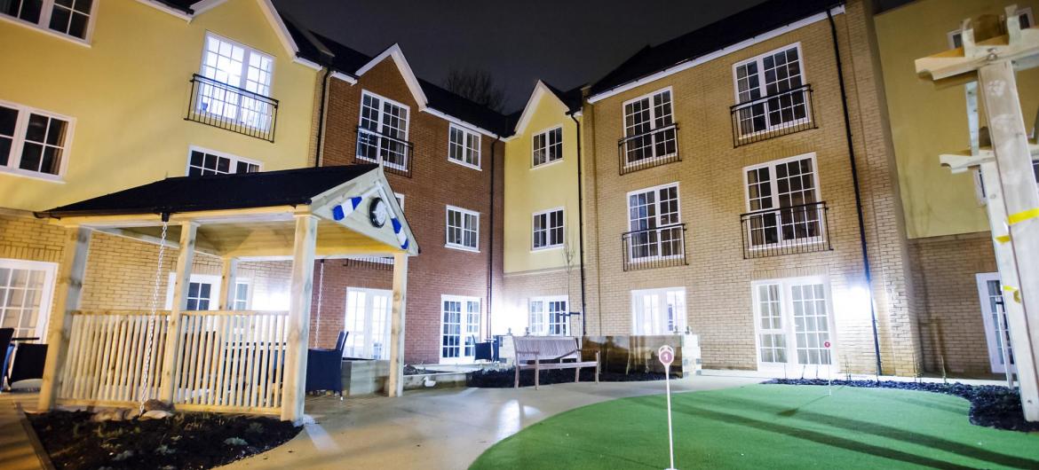 The front entrance of the Iffley Residential and Nursing Home beautifully lit up a night.