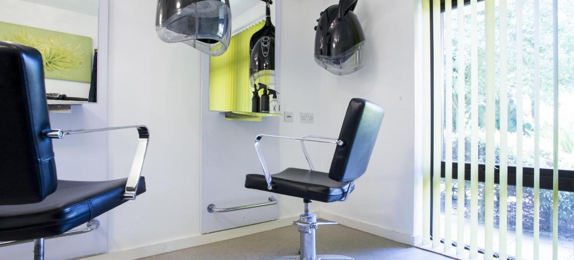 A black and lime green, modern hair dressing salon at the Parkview House Residential Care Home.