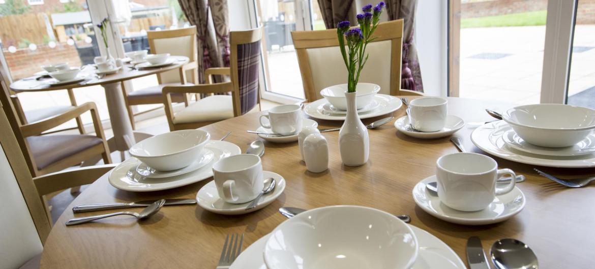 The beautifully set dining room tables at Meadow View Residential Care Home.