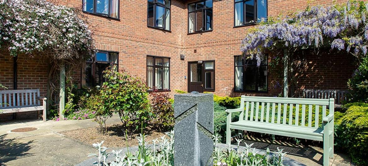 Outdoor seating in the gardens at Dalby Court Residential Care Home in Middlesbrough