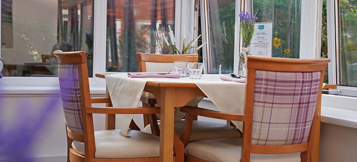 Dining area inside the conservatory at Fernihurst Nursing Home in Devon