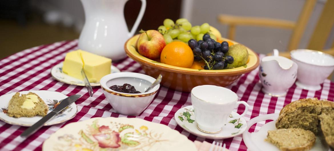 A table set for breakfast with fruit, toast and butter at Forest Dene Residential Care Home.