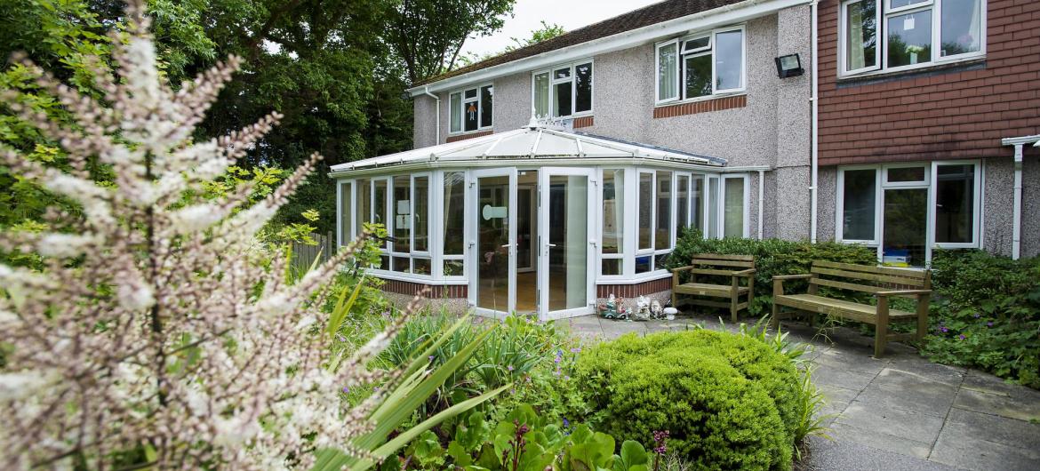 The view across the back garden towards the conservatory at the Furzehatt Care Home.