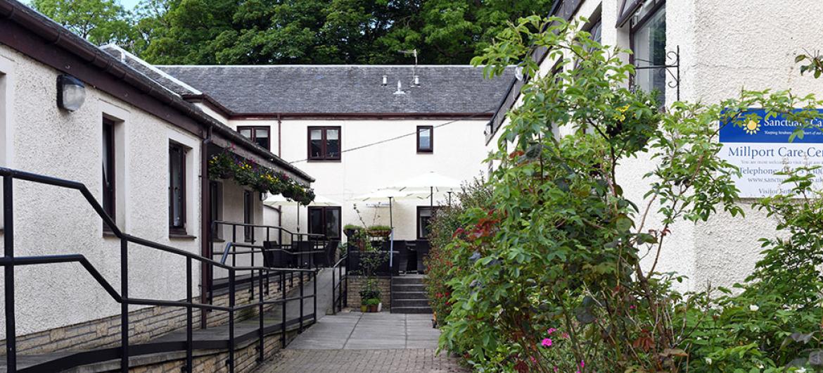 Entrance of Millport care home with a surrounding garden area.