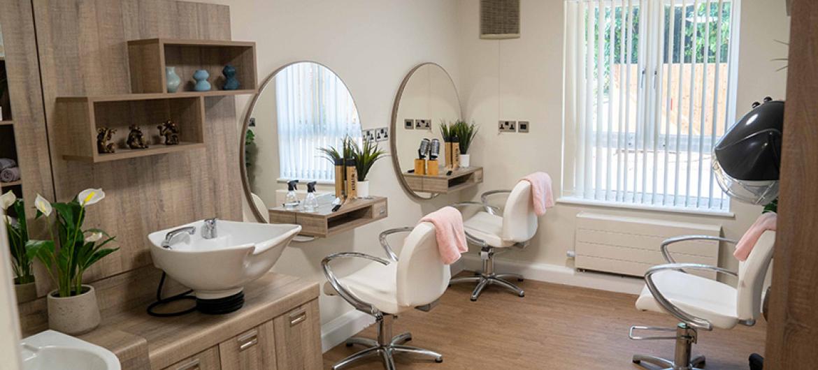 A modern salon area with a neutral colour palette. The use of rectangles and circles create a very contemporary feel. 