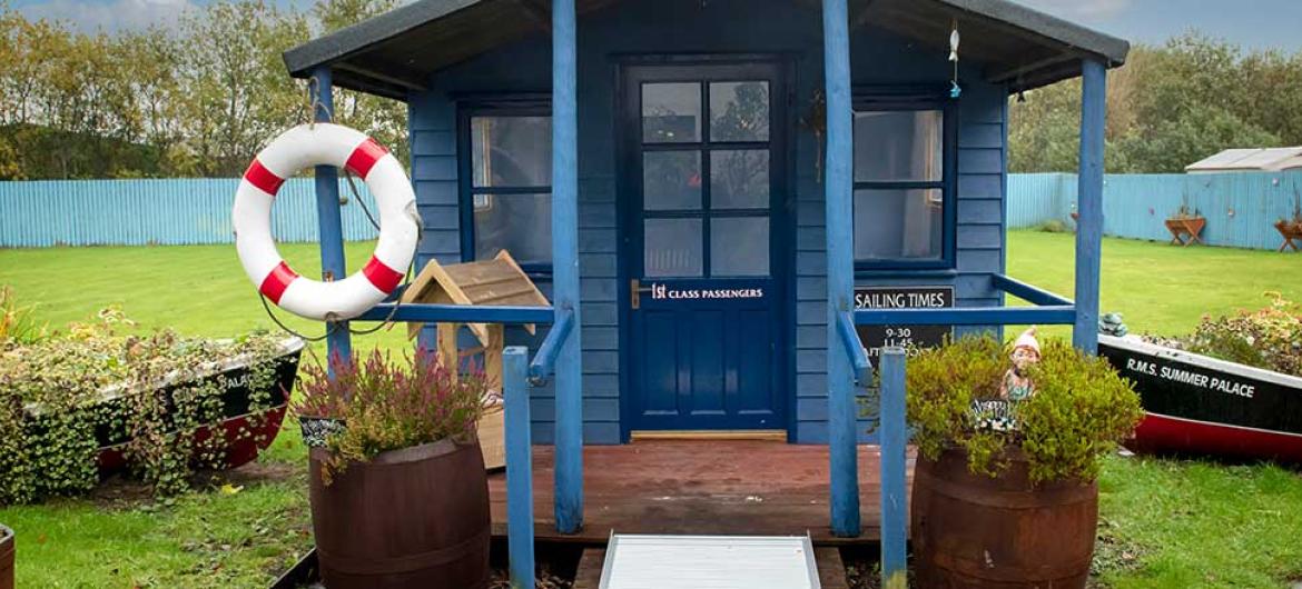 Wonderful garden with seaside themed hut The Meadows Care Home in Dornoch