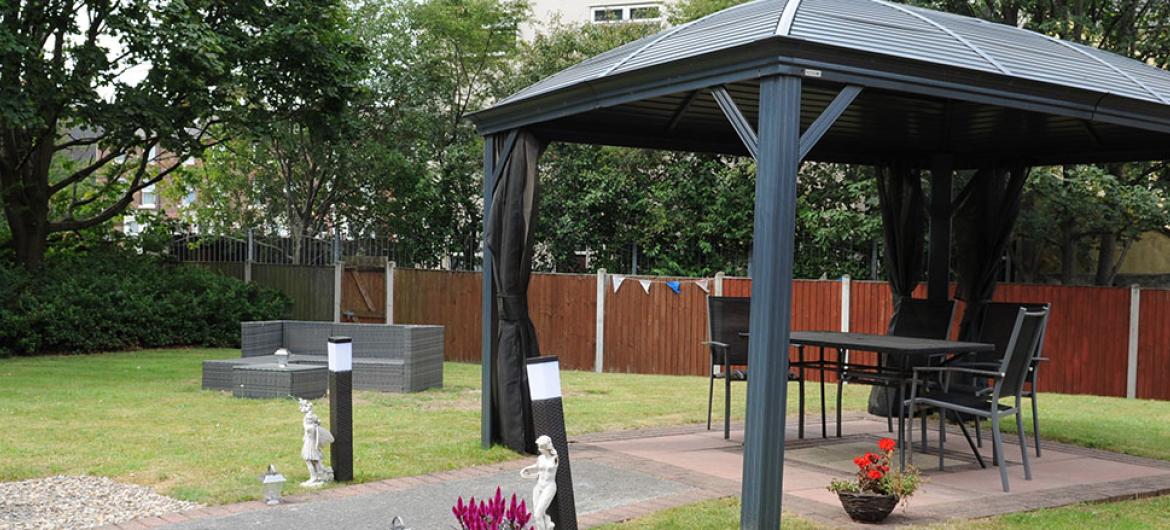 Outdoor seating area at Willow Gardens Residential and Nursing Home in Merseyside