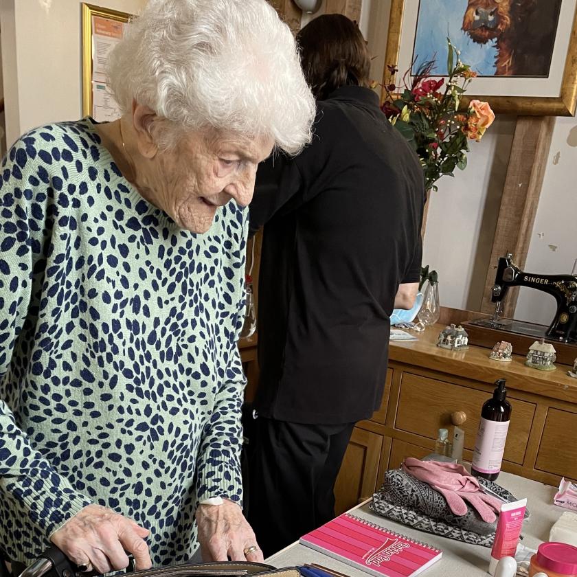 Residents support Love Grace Appeal Joan, a resident of Lyons Court Residential Care Home in Chelmsford, helps to fill pre-loved handbags with items for victims of domestic abuse, to support the Love Grace appeal