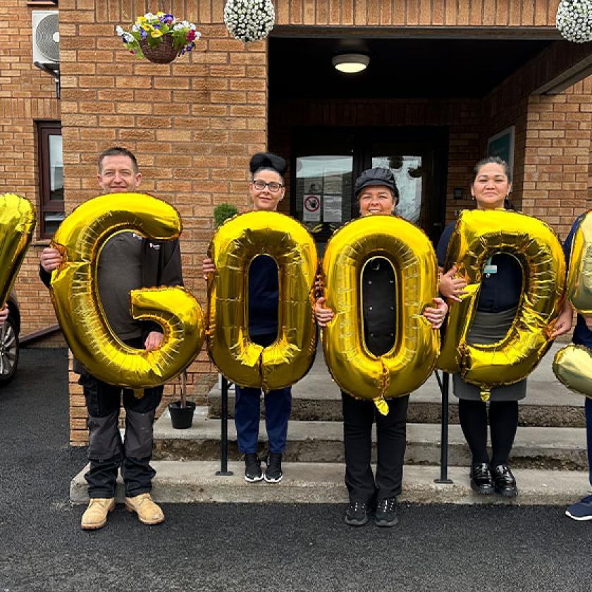 Celebrating Very Good in all areas! The team at Abercorn House holding balloons to celebrate their Very Good Care Inspectorate rating