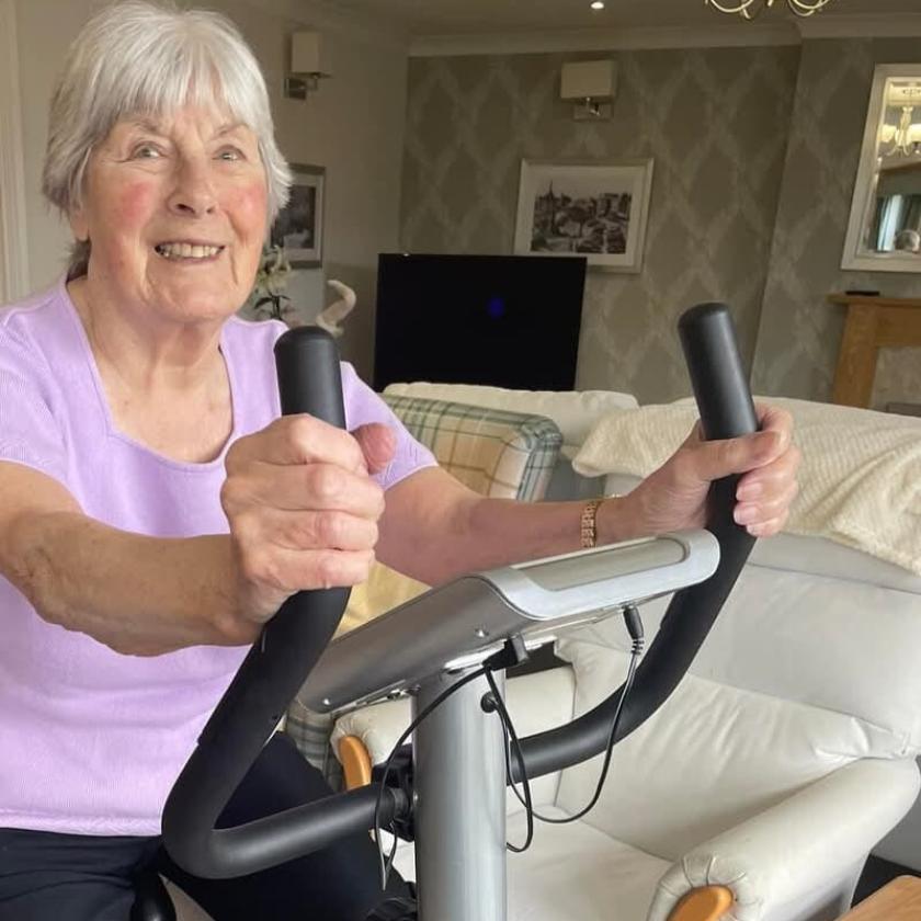 Briggs Lodge resident Mavis cycling on an exercise bike.