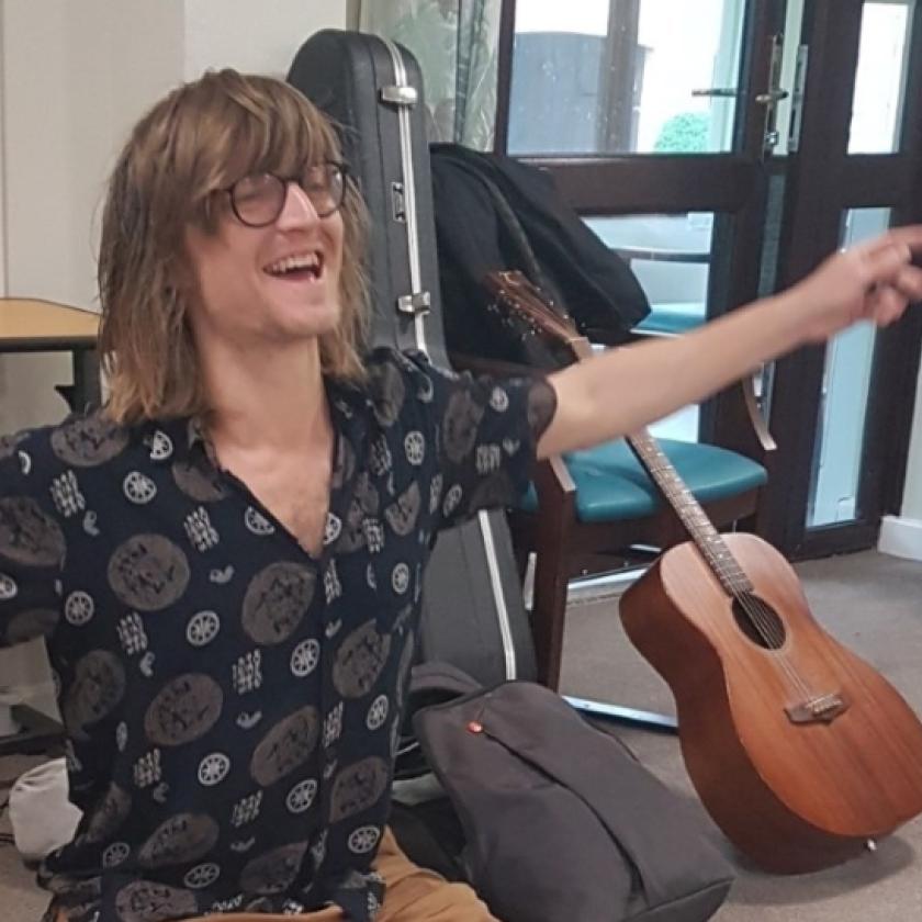 Charlie Law brings music to our care home residents