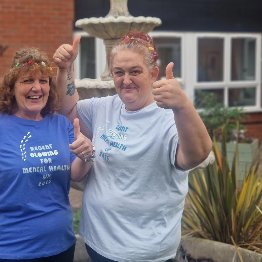 Staff stood together smiling