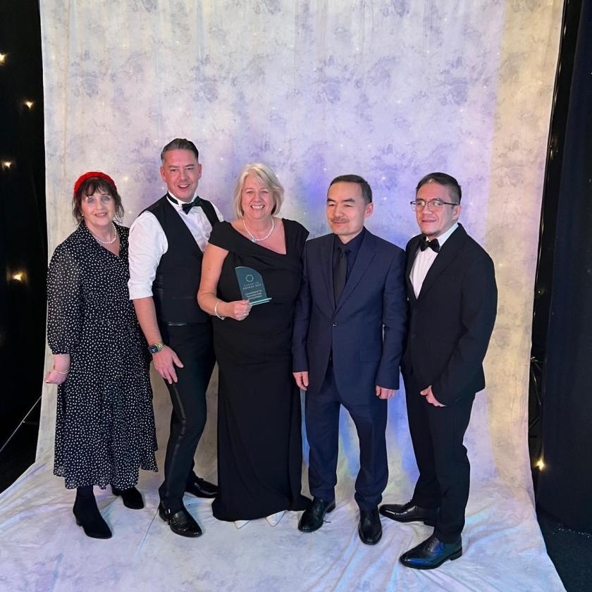 Staff stood together smiling