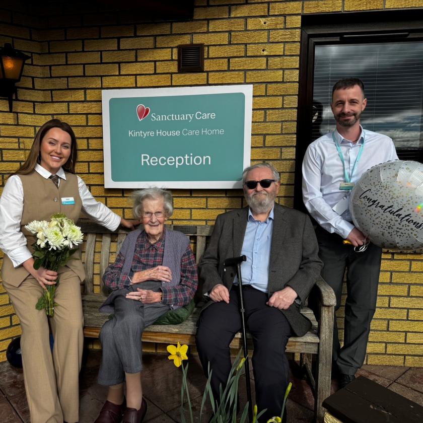Staff and residents together smiling