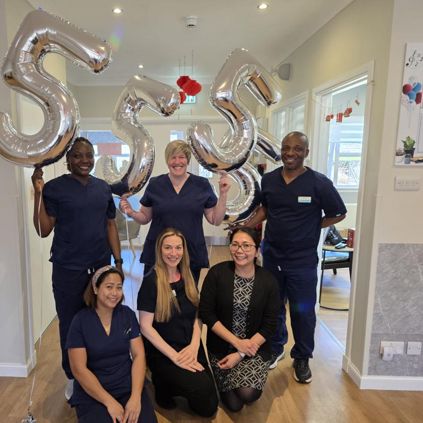 Staff stood together smiling