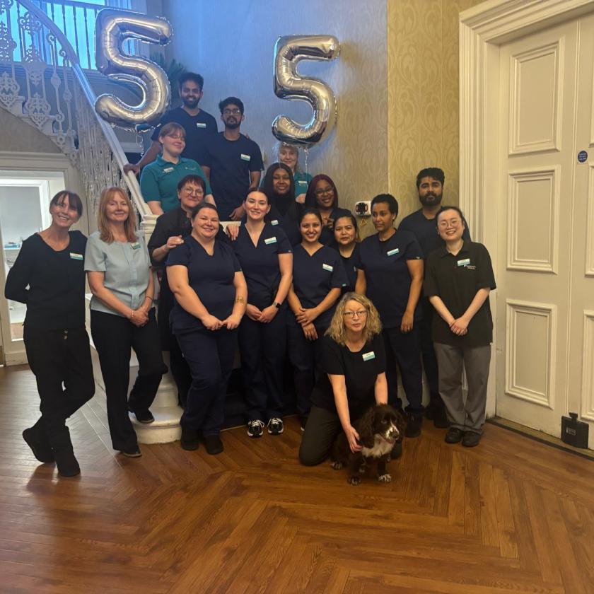 Staff stood together smiling