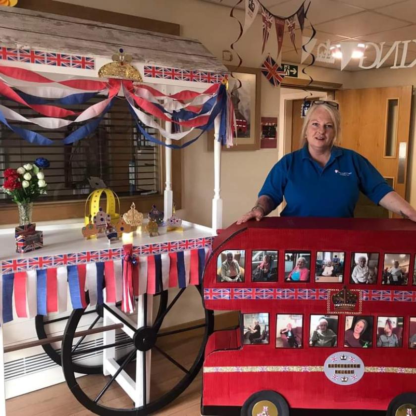 Activity Coordinator Amanda Adamson, with her London bus creation featuring each of the residents.