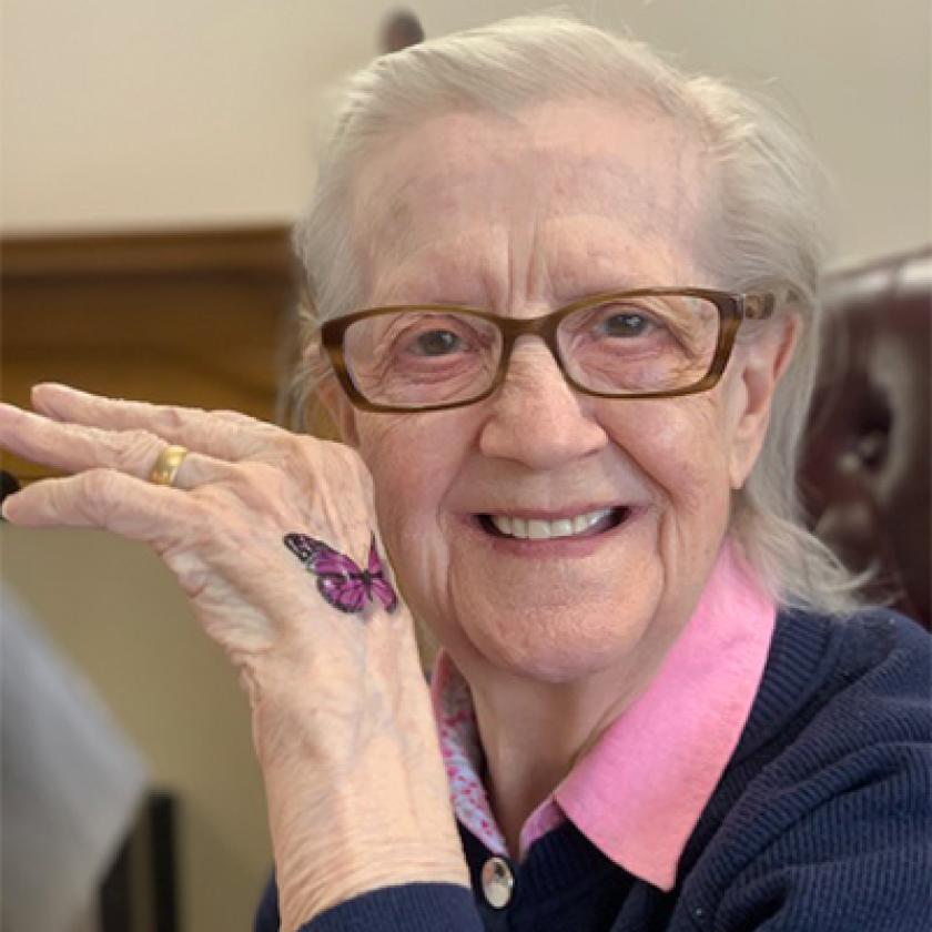Kintyre House resident shows off a temporary butterfly tattoo on their back of their hand