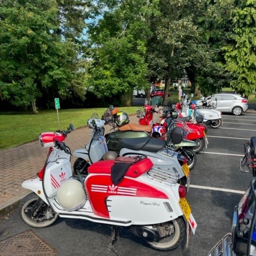 A collection of motorbikes in a car park