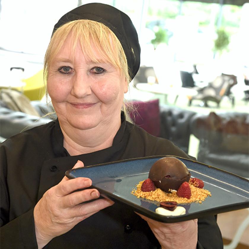 Rowena Graham holding a plate of food