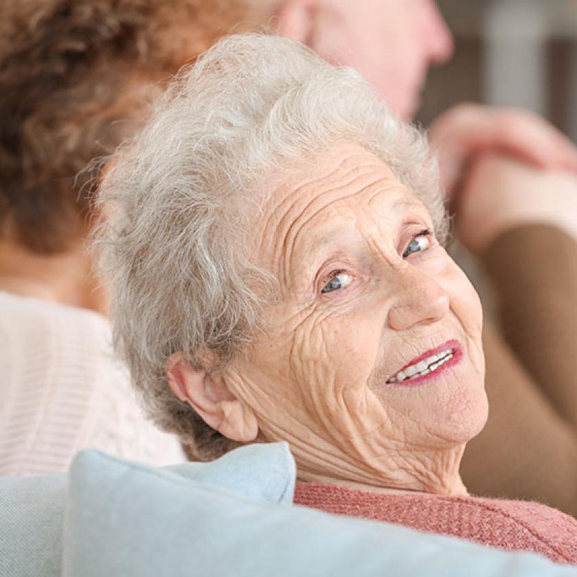A happy senior lady wearing make up smiling