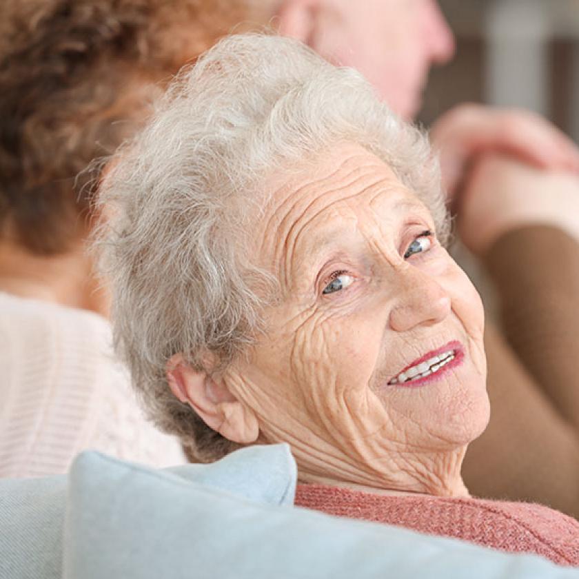 A happy senior lady wearing make up smiling 