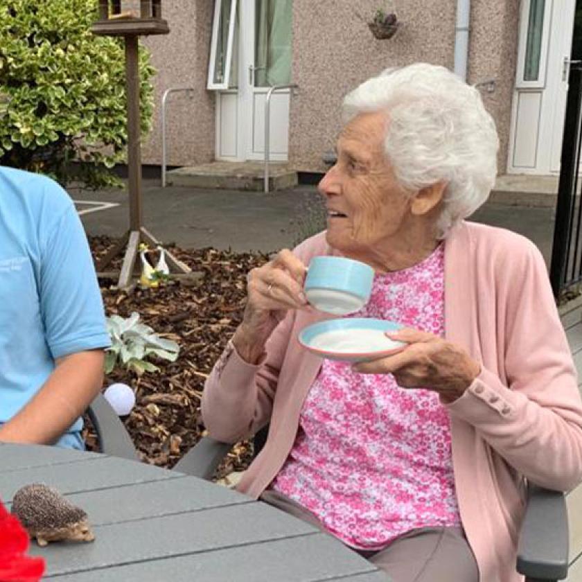 Transforming gardens Ground Force-style! Staff member Josh Morrisey and resident Eveline Oliver at Furzehatt Residential and Nursing Home in Plymouth