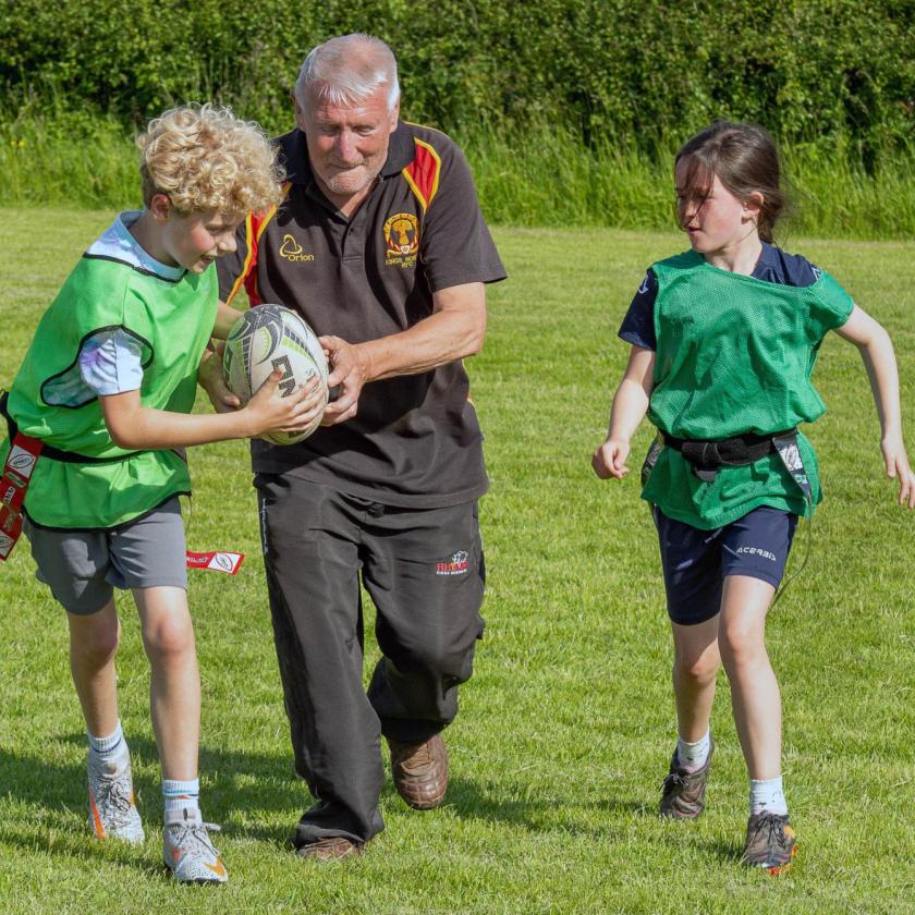 Ron Bunce, resident at Castlecroft Residential Care Home in Birmingham coaching children's rugby 
