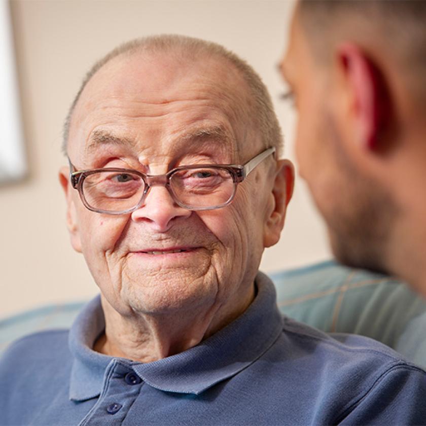 Sanctuary care staff and resident having a chat