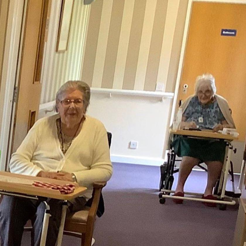 Shaftesbury House residents playing corridor bingo