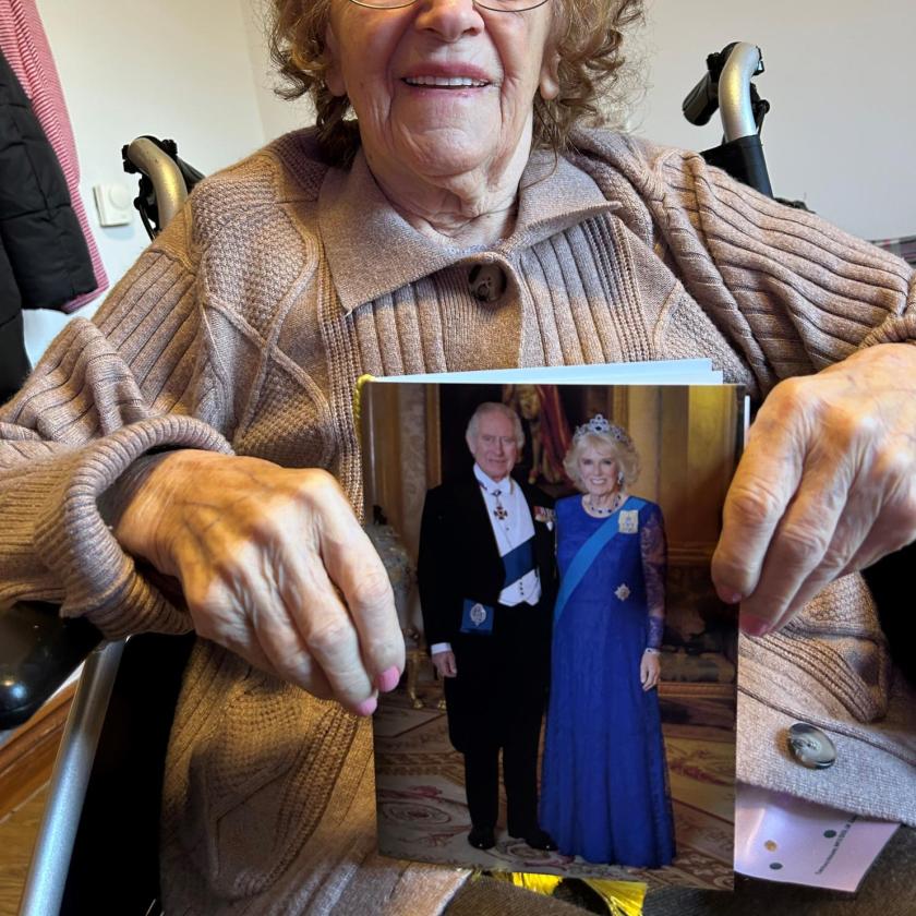 Resident Stella with her 100th birthday card from King Charles and Camilla